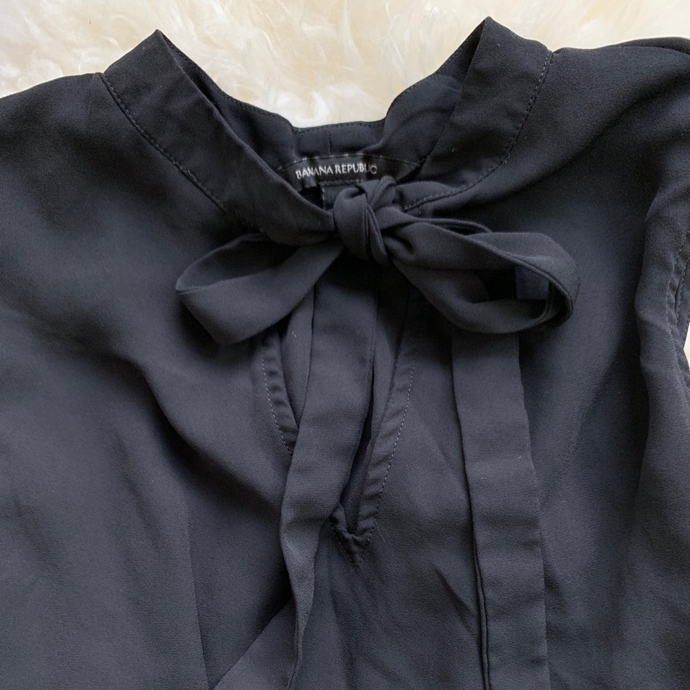 Sleeveless Tie-Neck Peplum Blouse